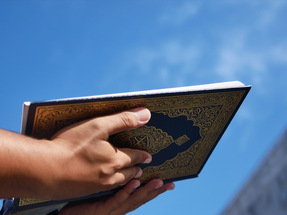 a person holding a book in their hand