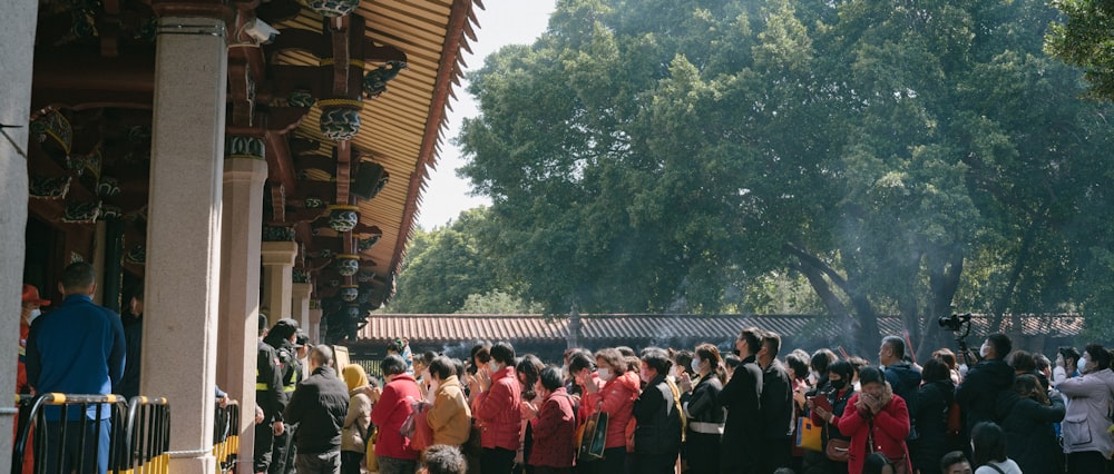 a group of people standing in front of a building