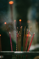 A peaceful setting with incense smoke rising during a spiritual ceremony.