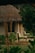 A serene vacation home surrounded by nature, featuring a cozy outdoor seating area.