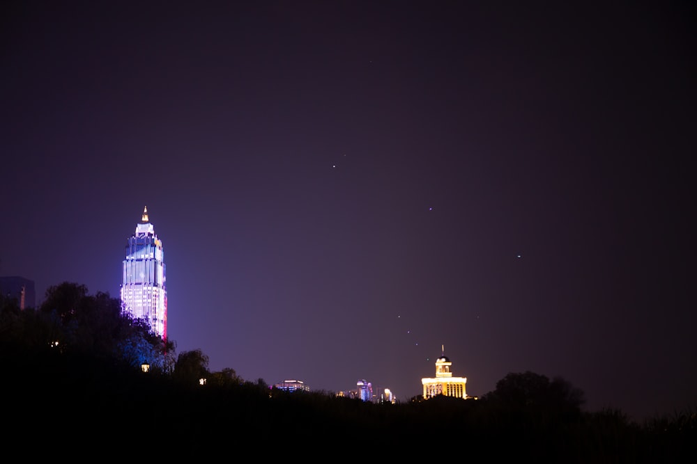 a very tall building with a sky line in the background