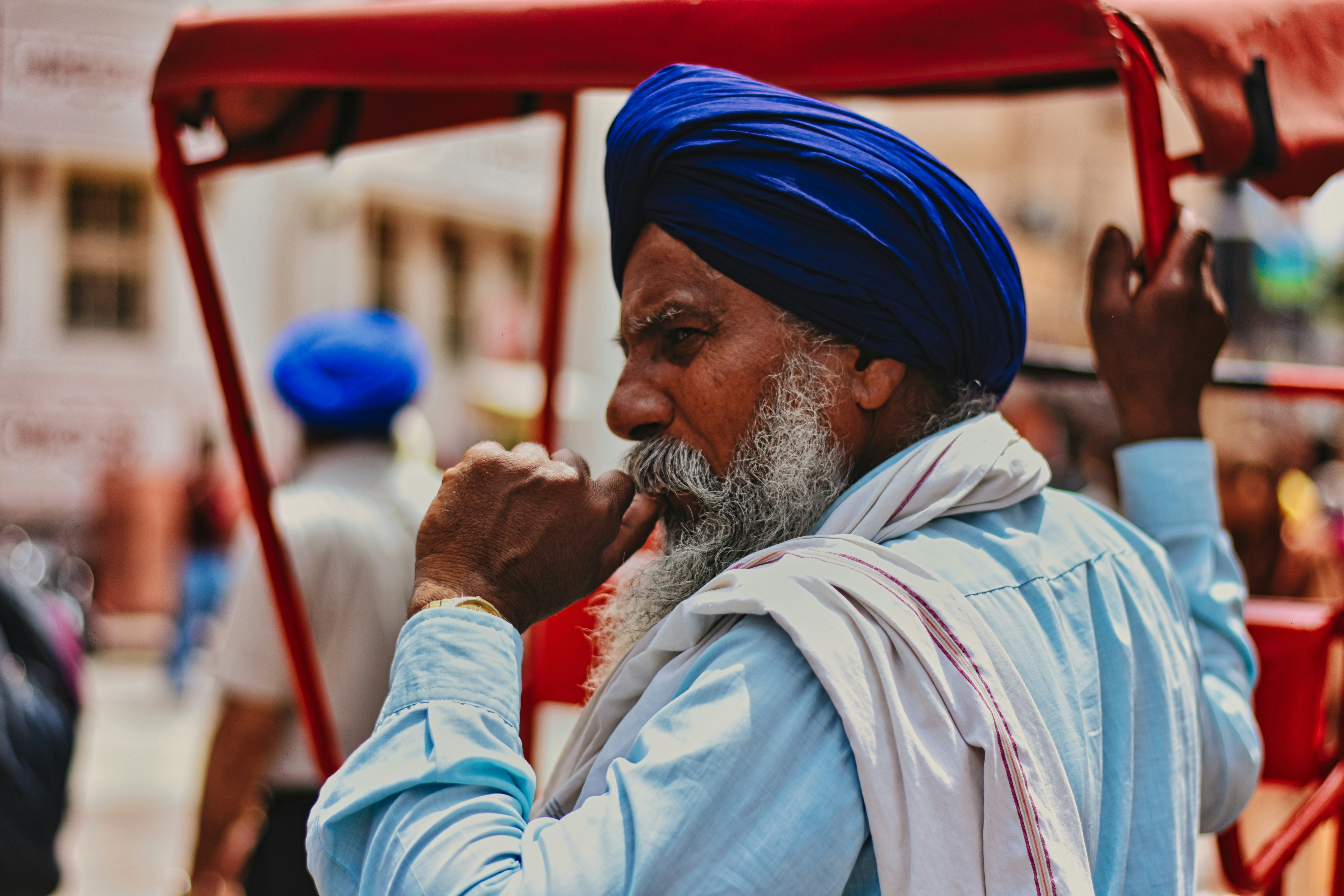 a man with a blue turban and a white beard