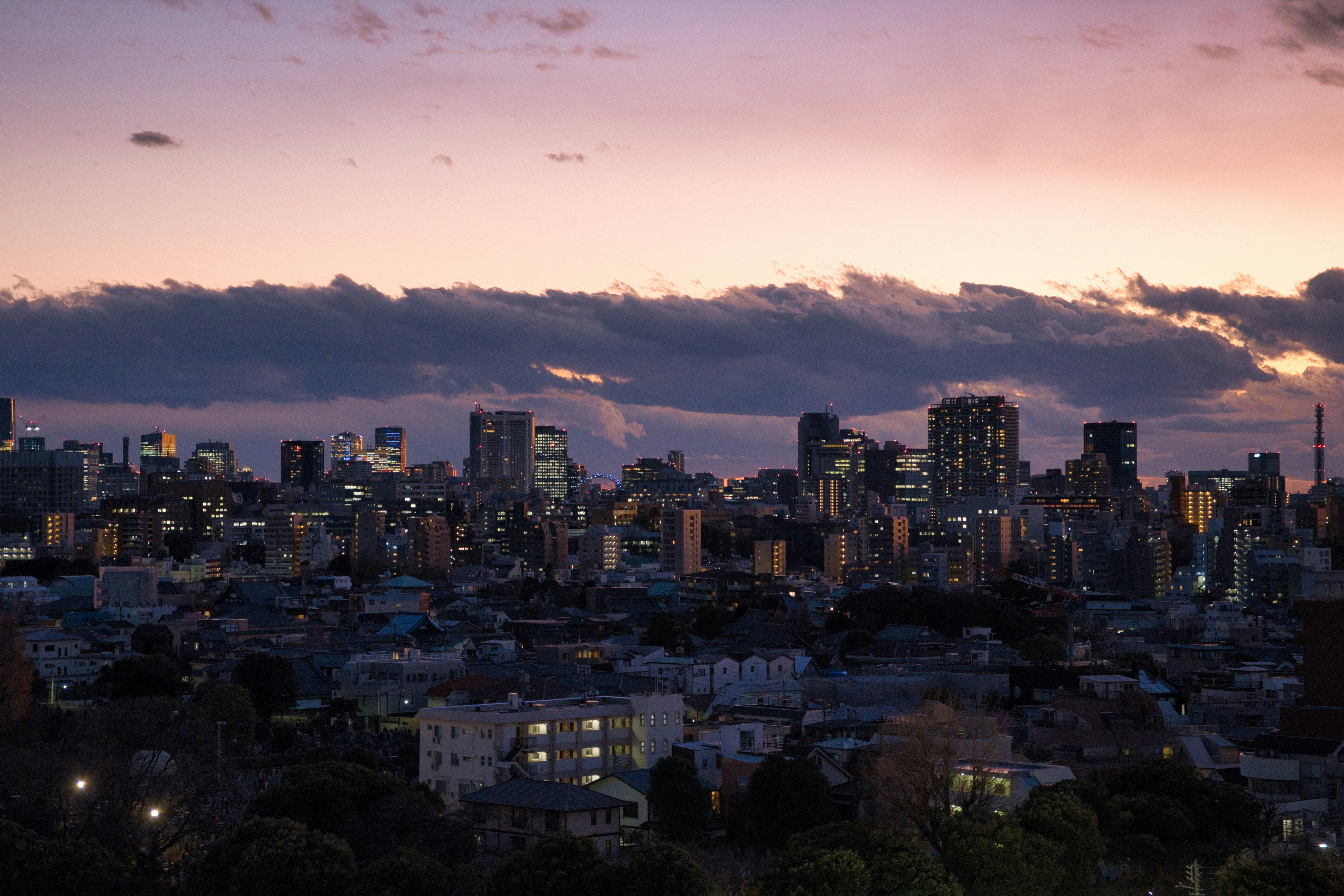 a view of a city skyline at dusk