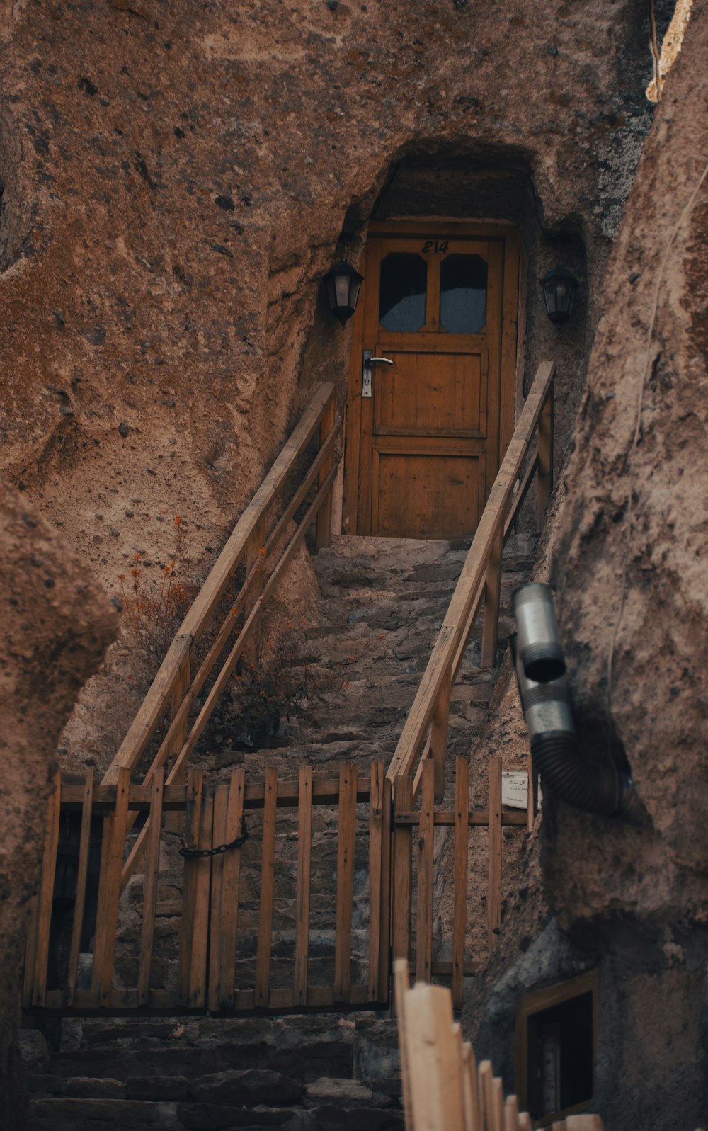 a staircase leading up to a wooden door