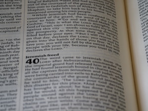 An open page of a book features text, with a passage titled 'Jeremiah freed' noticeable at the start of a new chapter numbered 40. The focus is on the text which is clearly legible and features a column format, typical of a Bible or religious text.