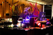 Elegant buffet setup featuring fresh pasta and vibrant Italian dishes under soft lighting.