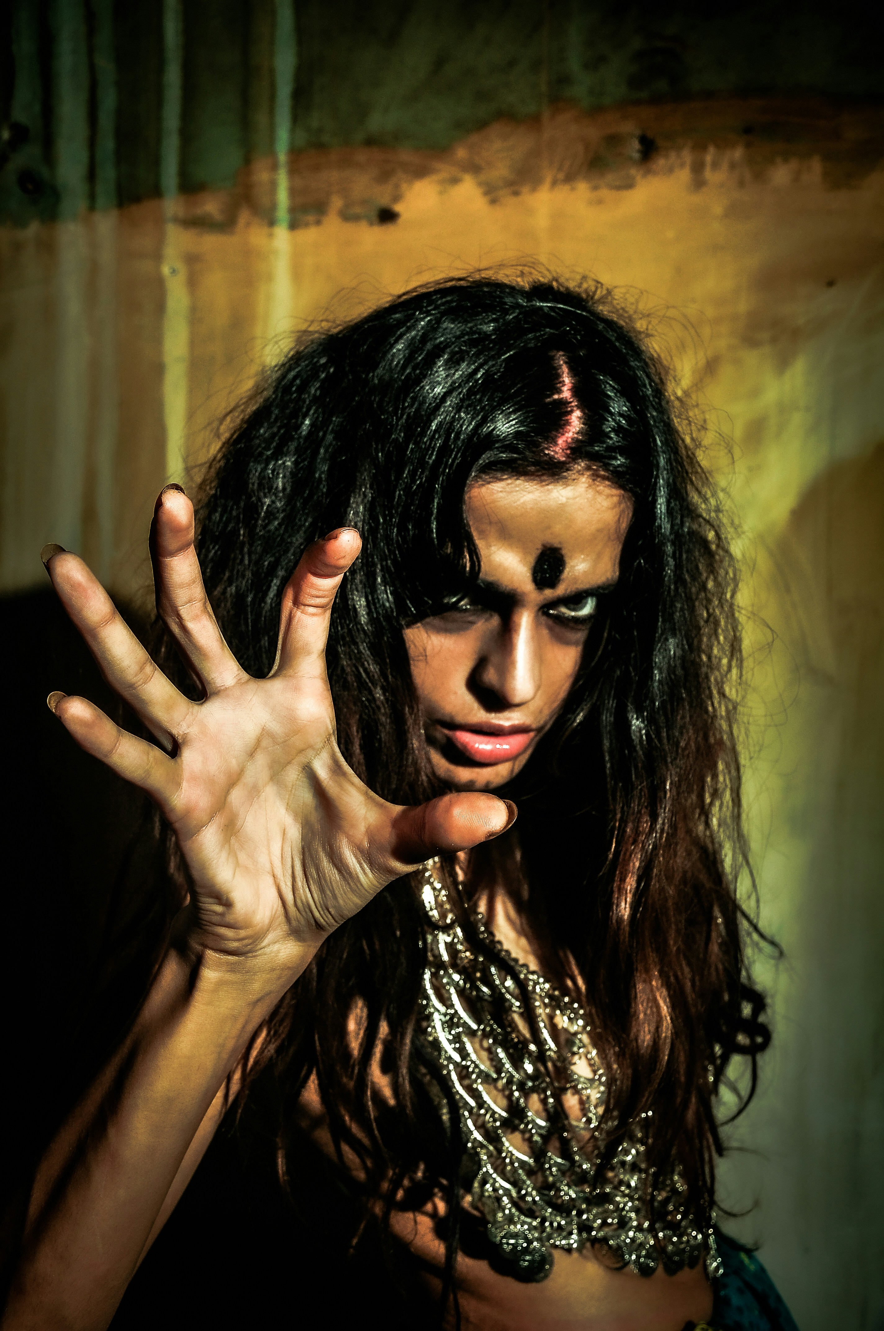 a woman in a costume holding her hands up