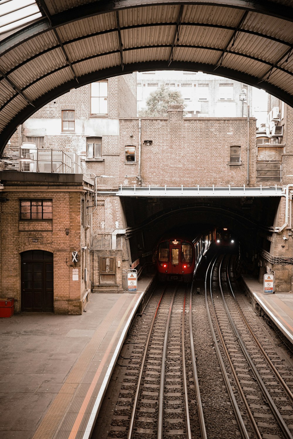 a train is coming out of a tunnel