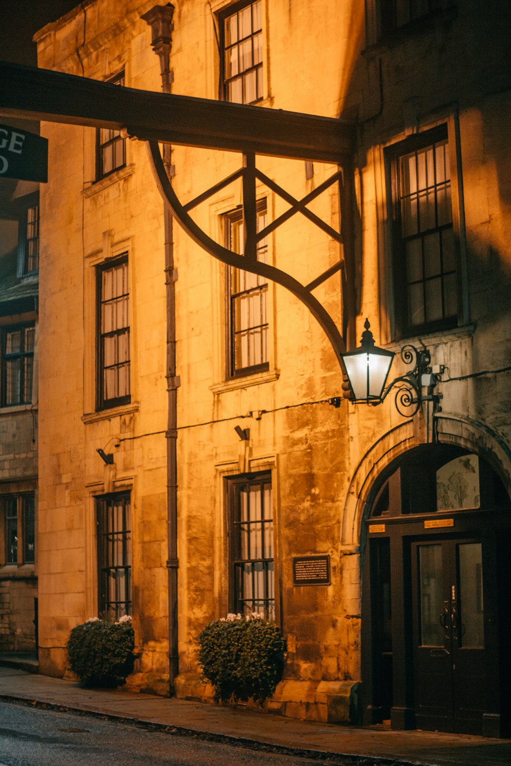 an old building with a street light in front of it