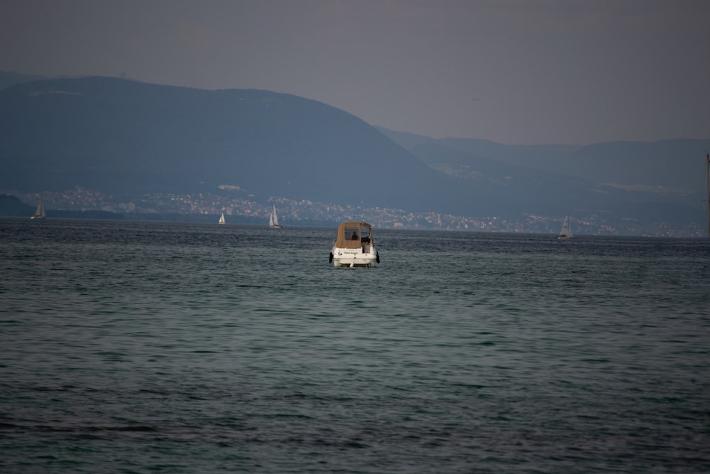 a boat floating on top of a large body of water