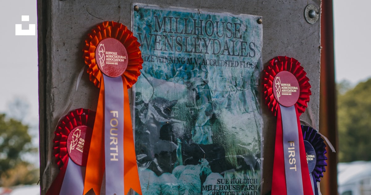A sign with several ribbons attached to it photo – Free Country show ...