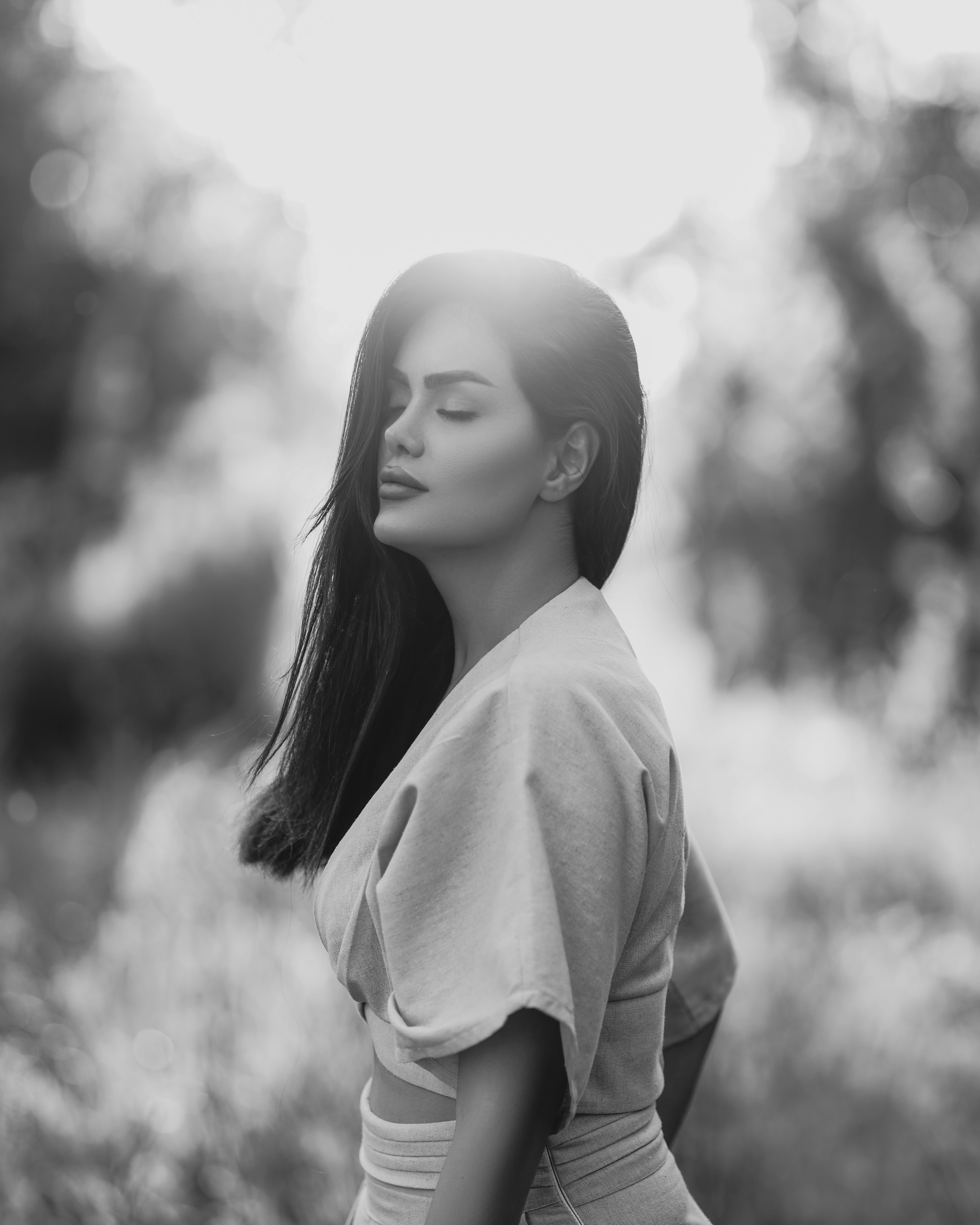 a black and white photo of a woman with long hair