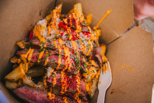 Loaded fries in a takeaway box