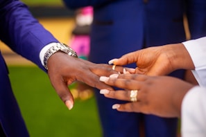 a close up of a person holding another person's hand