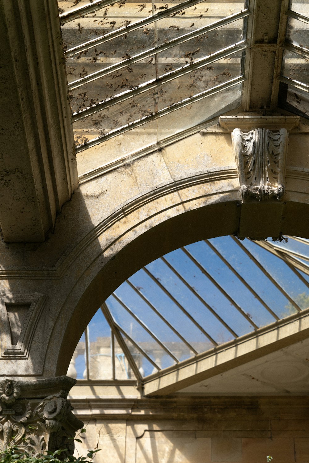 a clock on the side of a building with a skylight