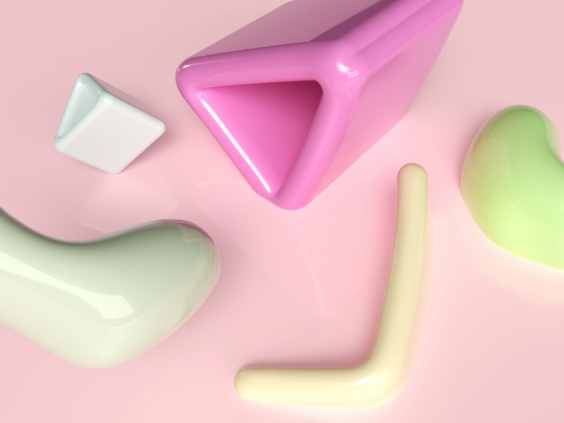a group of different shapes on a pink surface