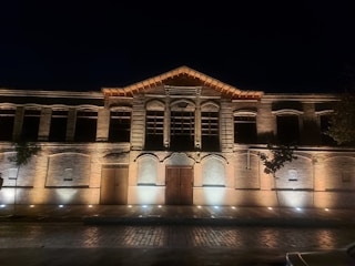 Well-lit commercial building exterior showcasing architectural lighting detailing.