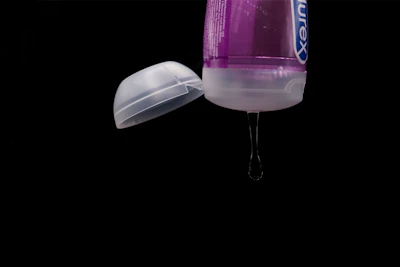 Close-up of a clear vial filled with bacteriostatic water, highlighting its purity