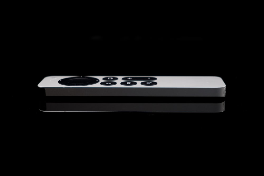 a black and white photo of a remote control