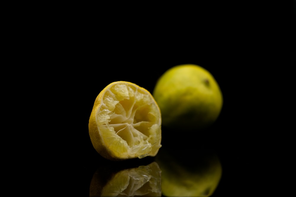 a half eaten lemon sitting on top of a table