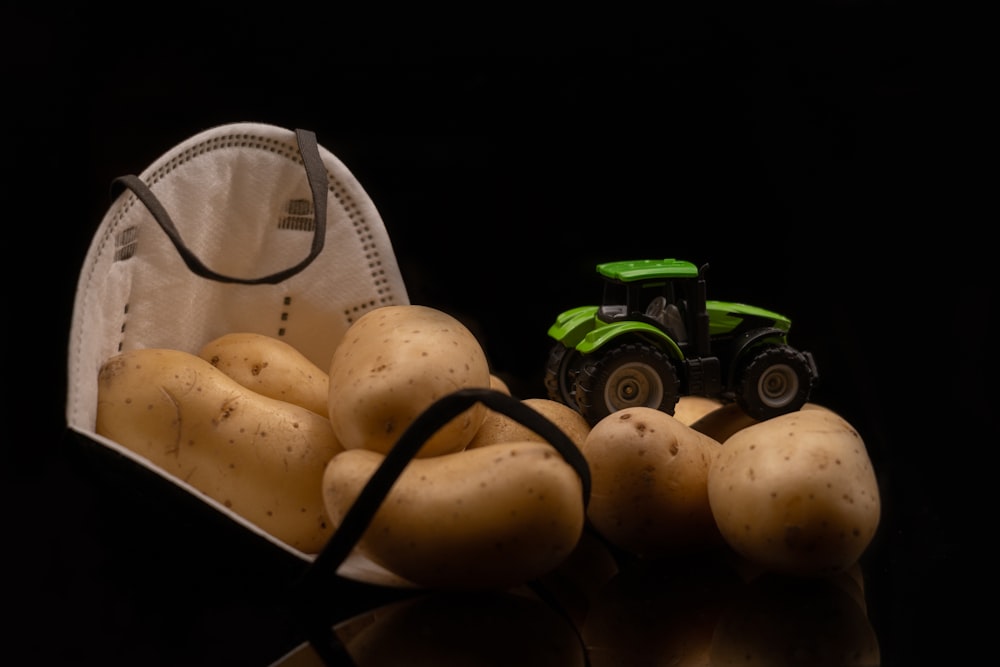 a bag of potatoes and a tractor on a table