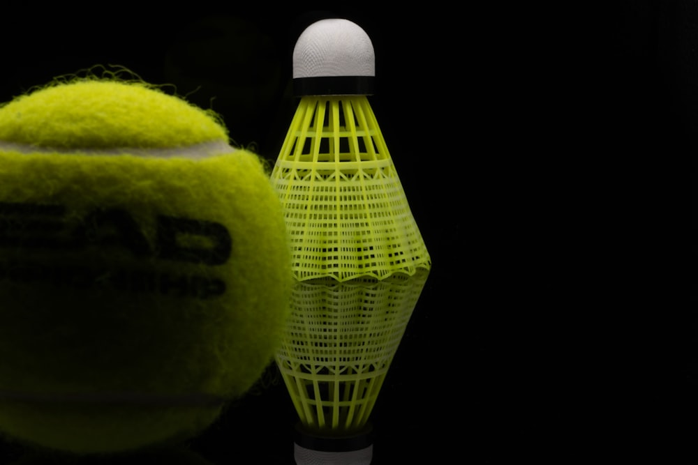 a close up of a tennis ball and a racket