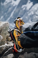 A close-up of high-quality mountaineering equipment on a rocky surface.