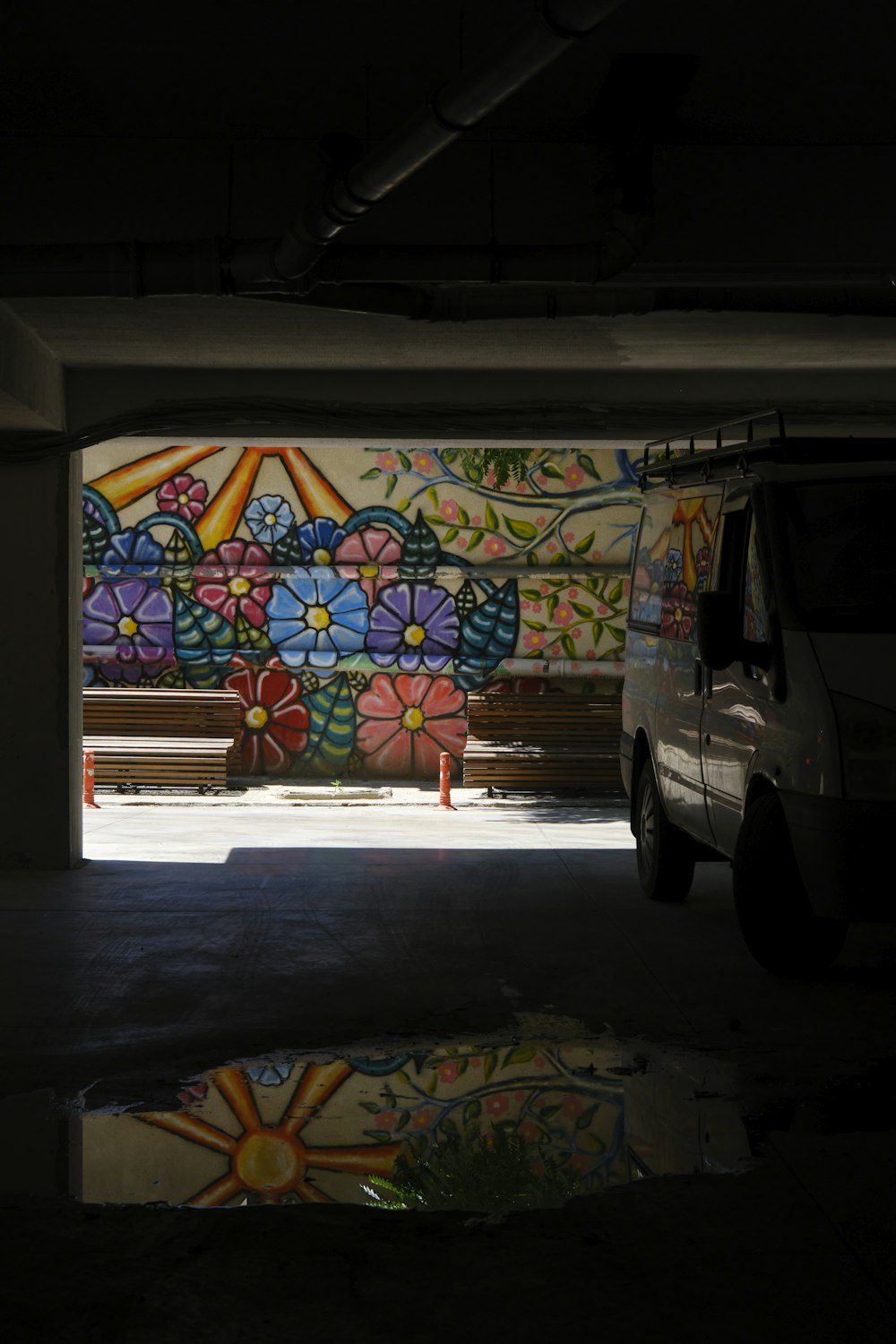 a white van parked in a parking garage