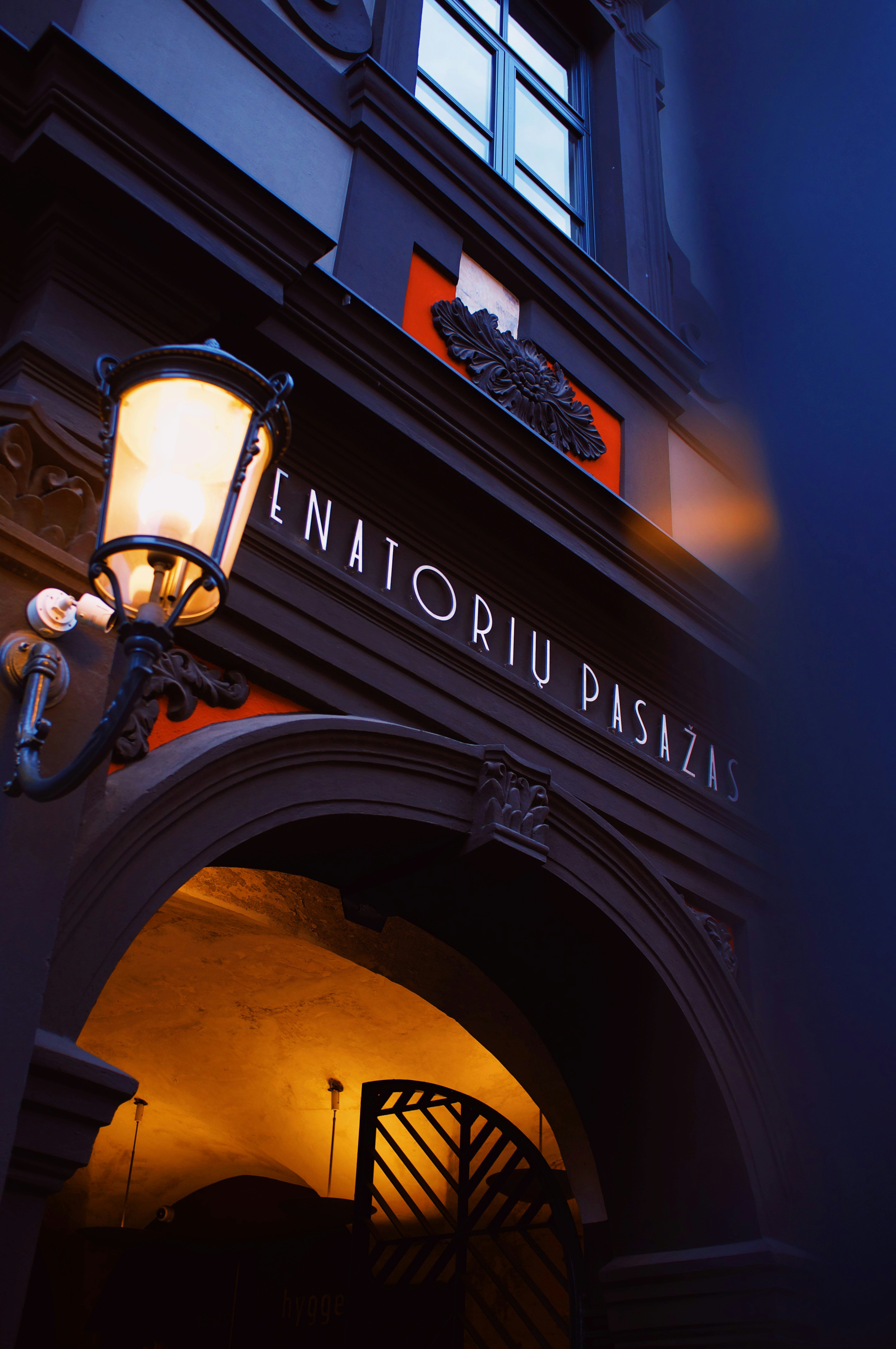 the entrance to a restaurant lit up at night