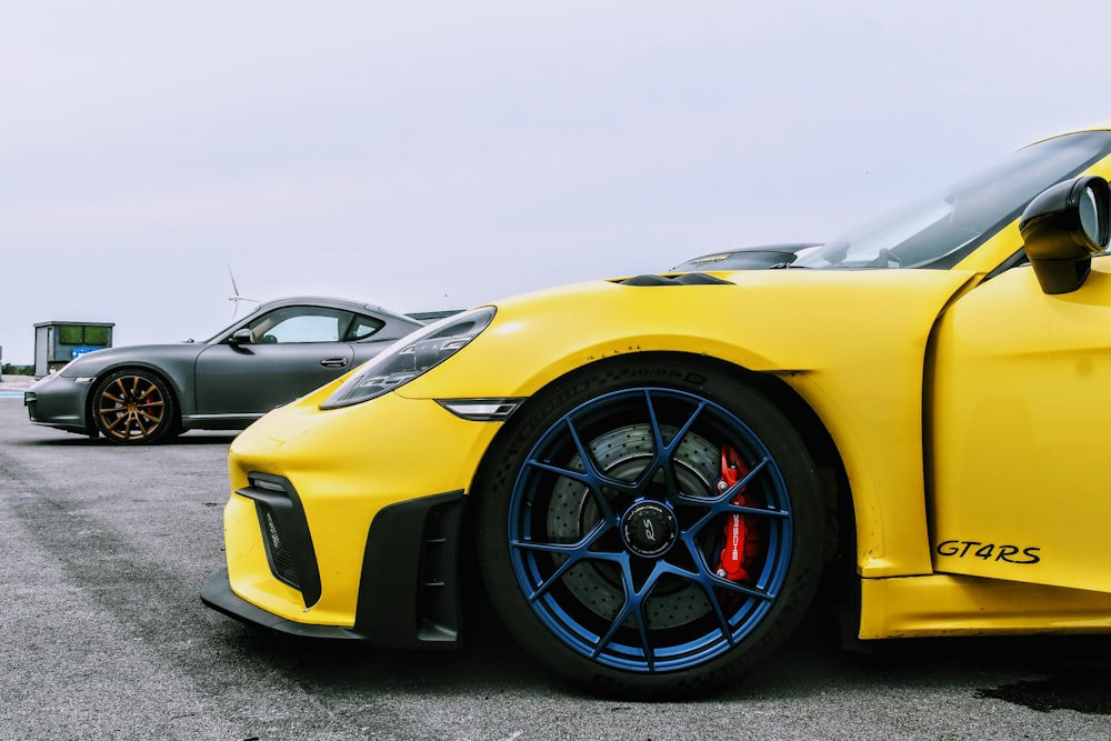 a yellow sports car parked in a parking lot