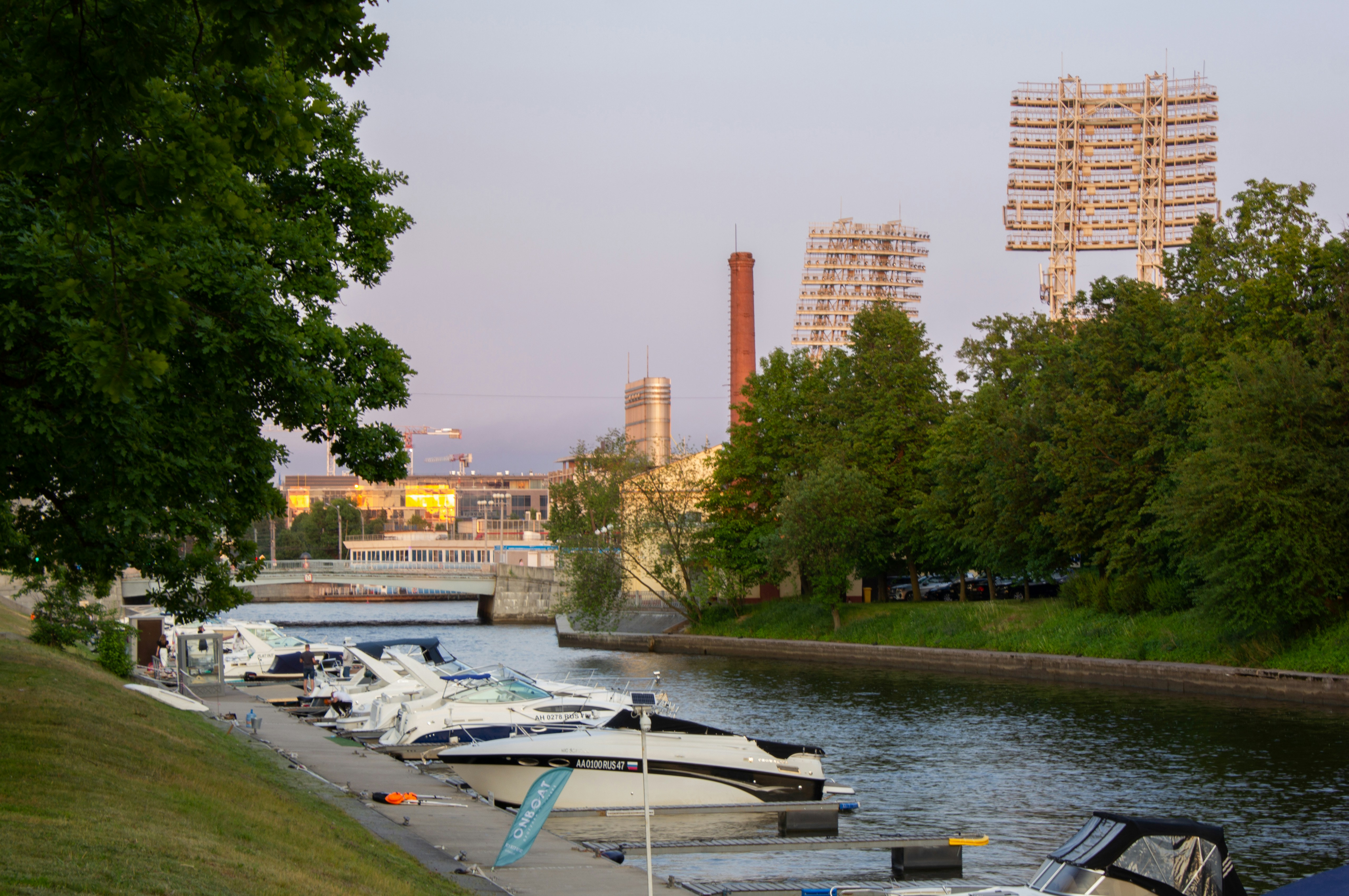 a row of boats parked on the side of a river