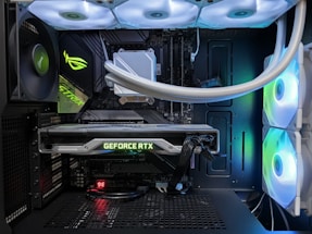 A sleek gaming PC setup with colorful RGB lighting and high-performance hardware components.