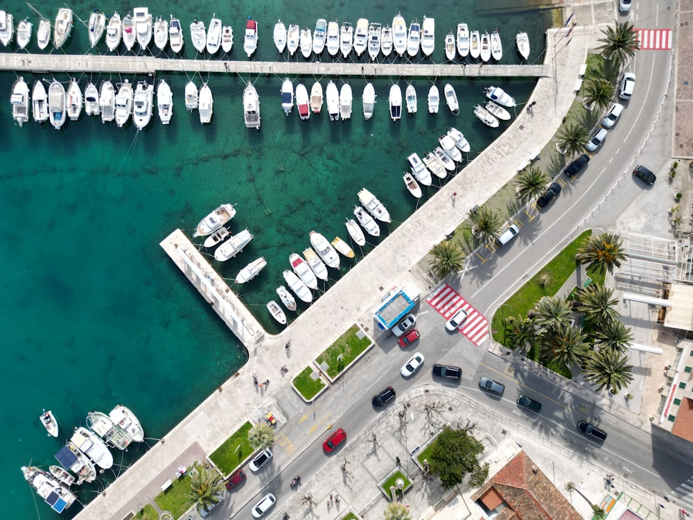 an aerial view of a marina with many boats