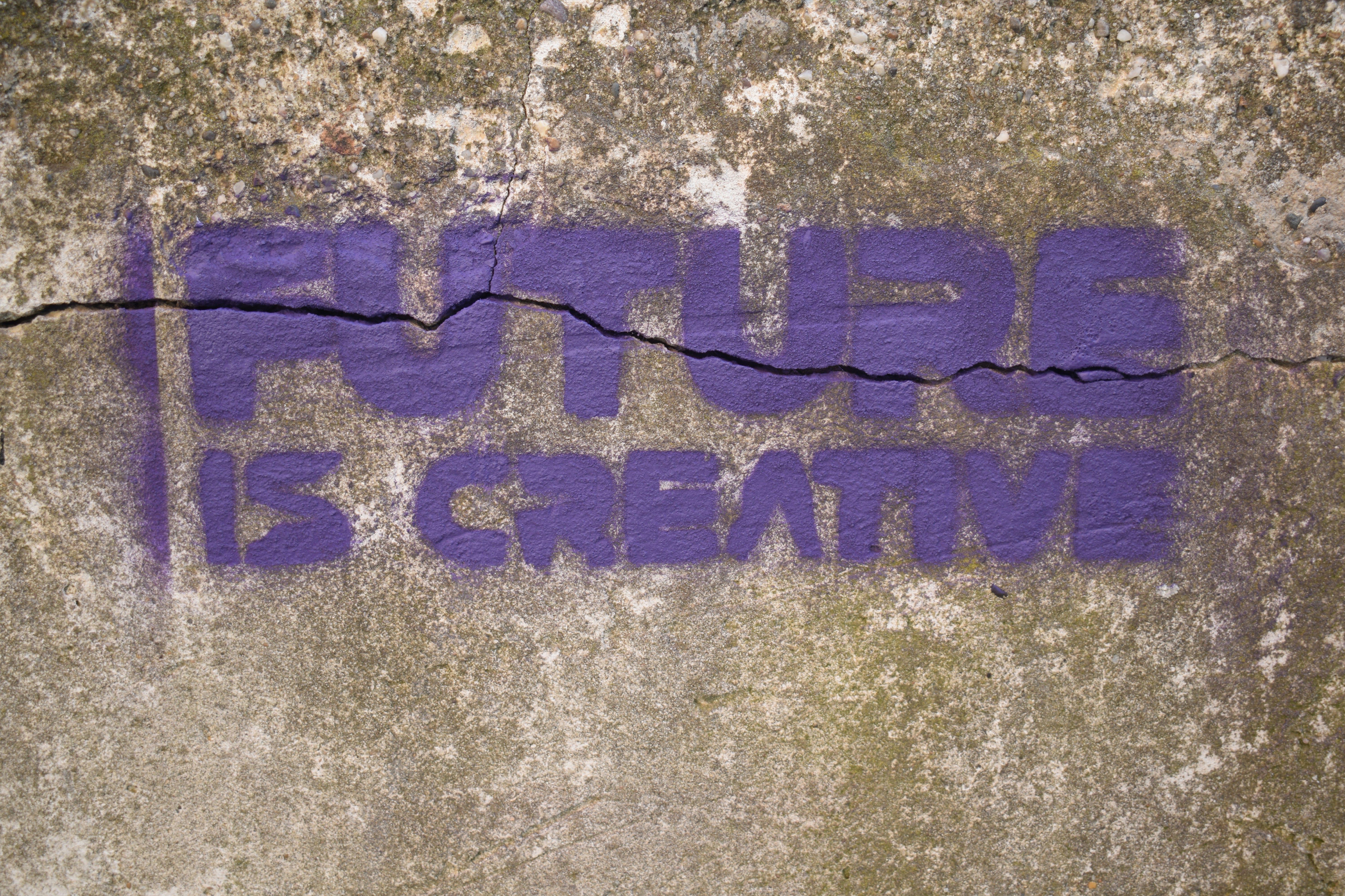 a piece of graffiti on a concrete wall
