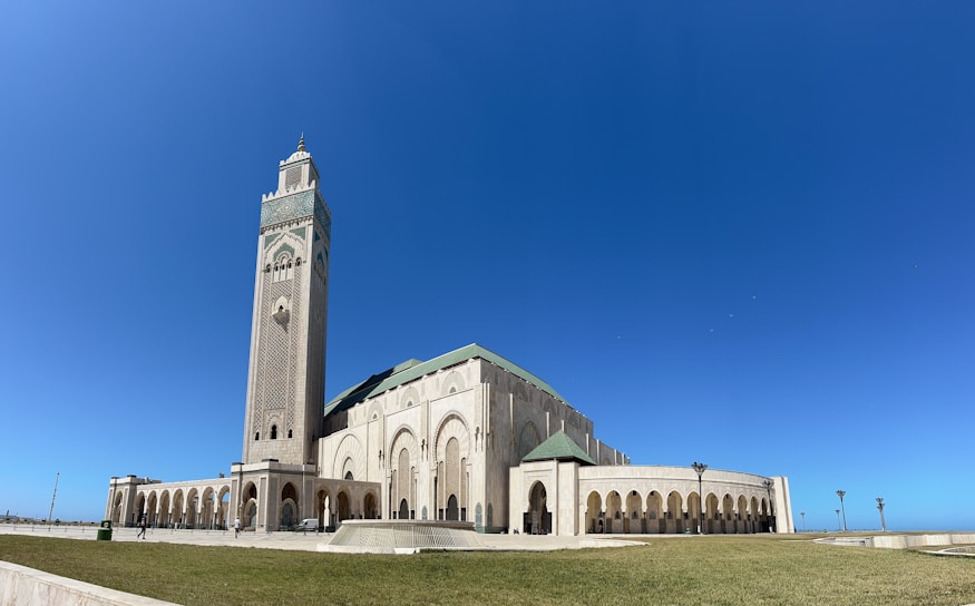 a large white building with a clock tower