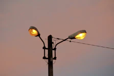 a street light with two lights on each of it's sides