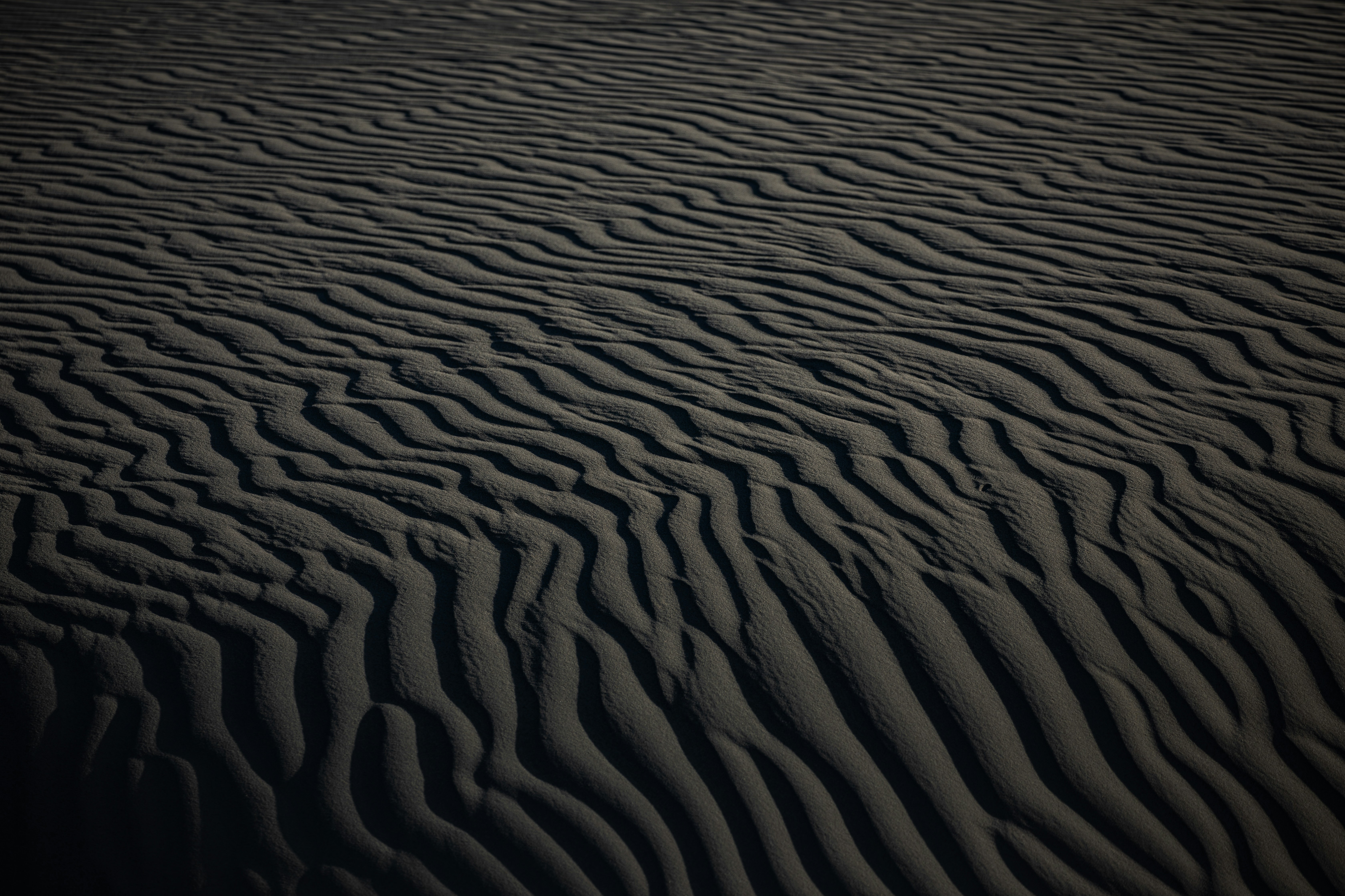 A large expanse of sand in the middle of a desert photo Free Nature