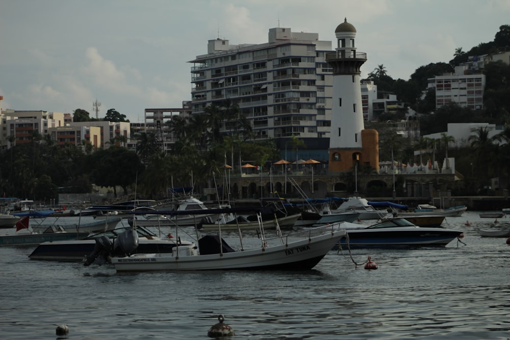 a group of boats floating on top of a body of water