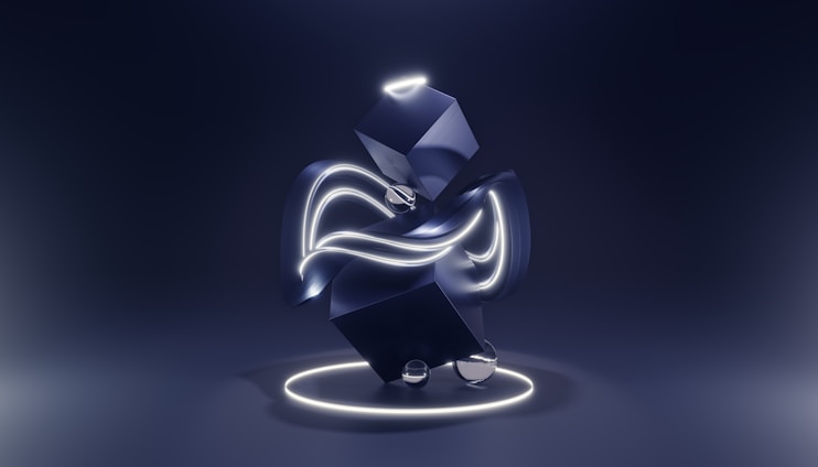 A close-up of a futuristic sculpture blending metal and light elements in a dimly lit gallery.