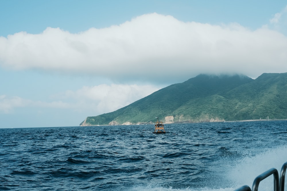 a boat in the middle of a body of water