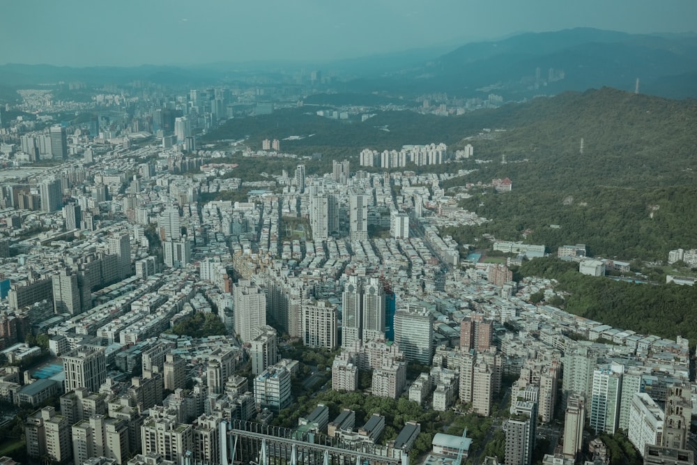 an aerial view of a city with tall buildings