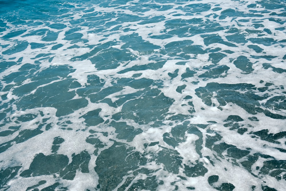 a large body of water with waves coming in