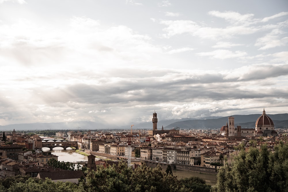 a view of a city with a bridge in the background