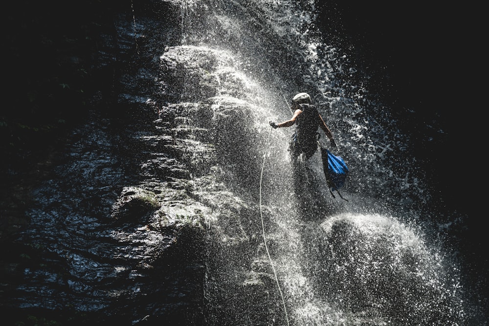 a man riding a wave on top of a surfboard