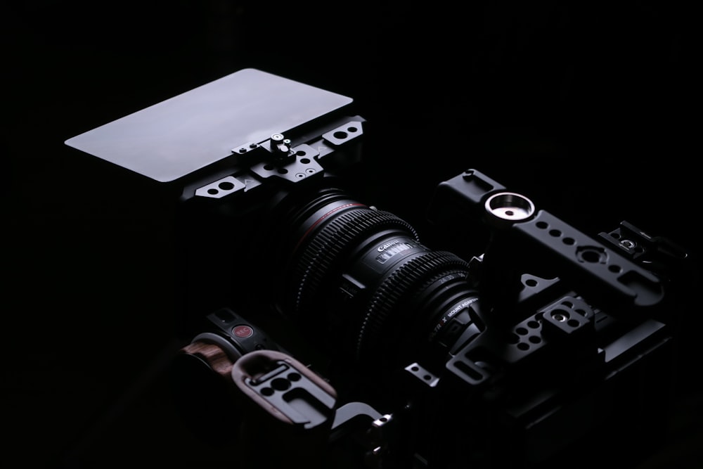 a camera in the dark with a white board on top of it