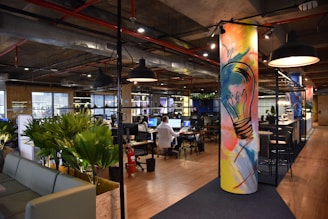 an office with a colorful mural on the wall