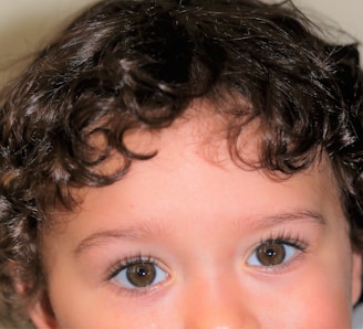 Close-up of Macarena’s sweet face with her soft curls and warm brown eyes.