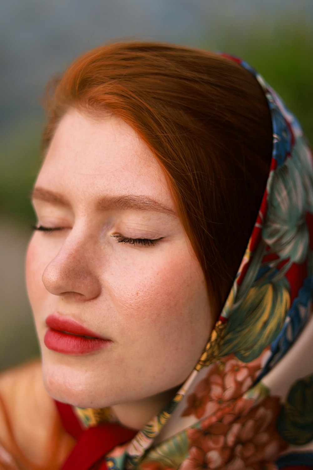 a close up of a person wearing a headscarf
