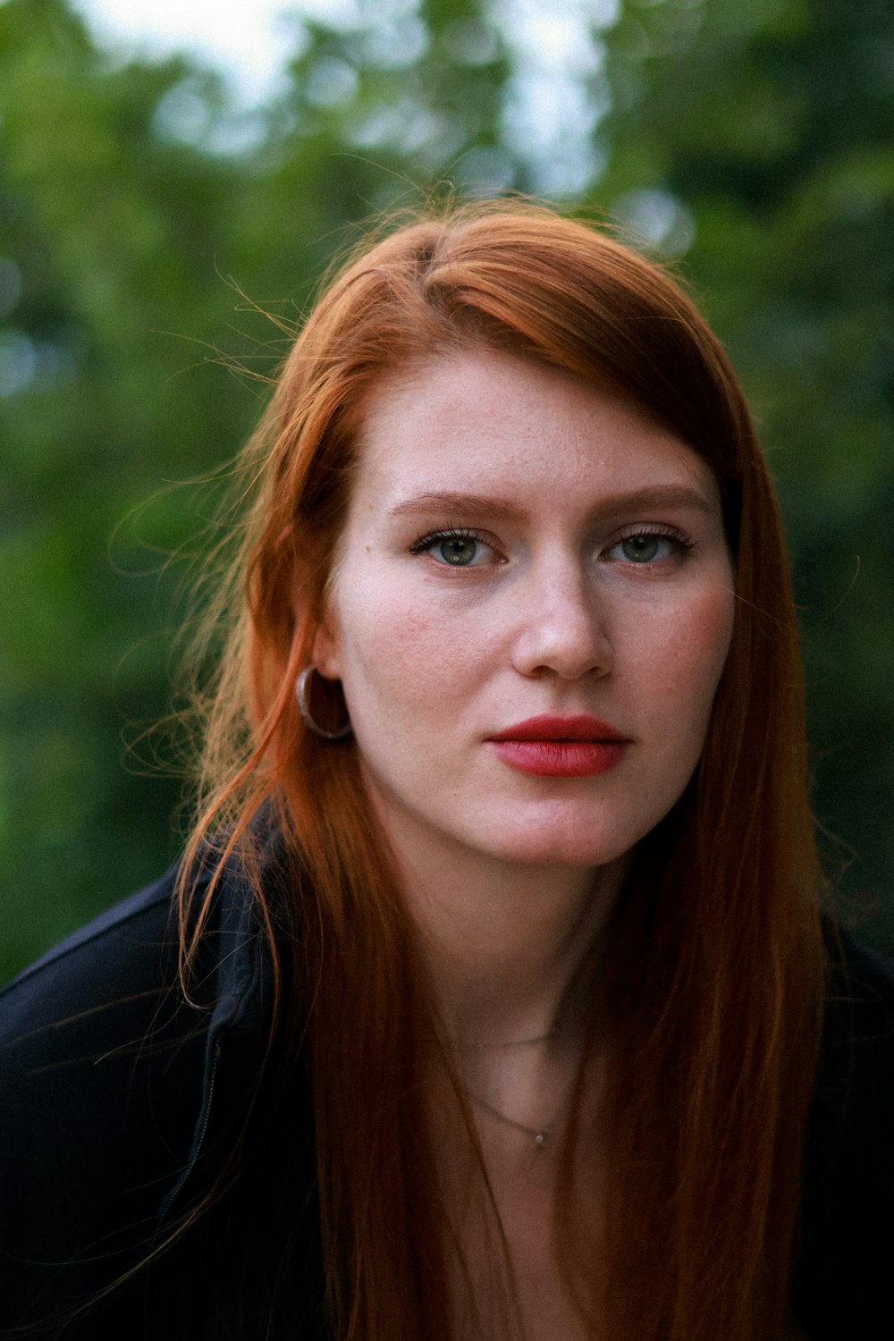 a close up of a person with red hair