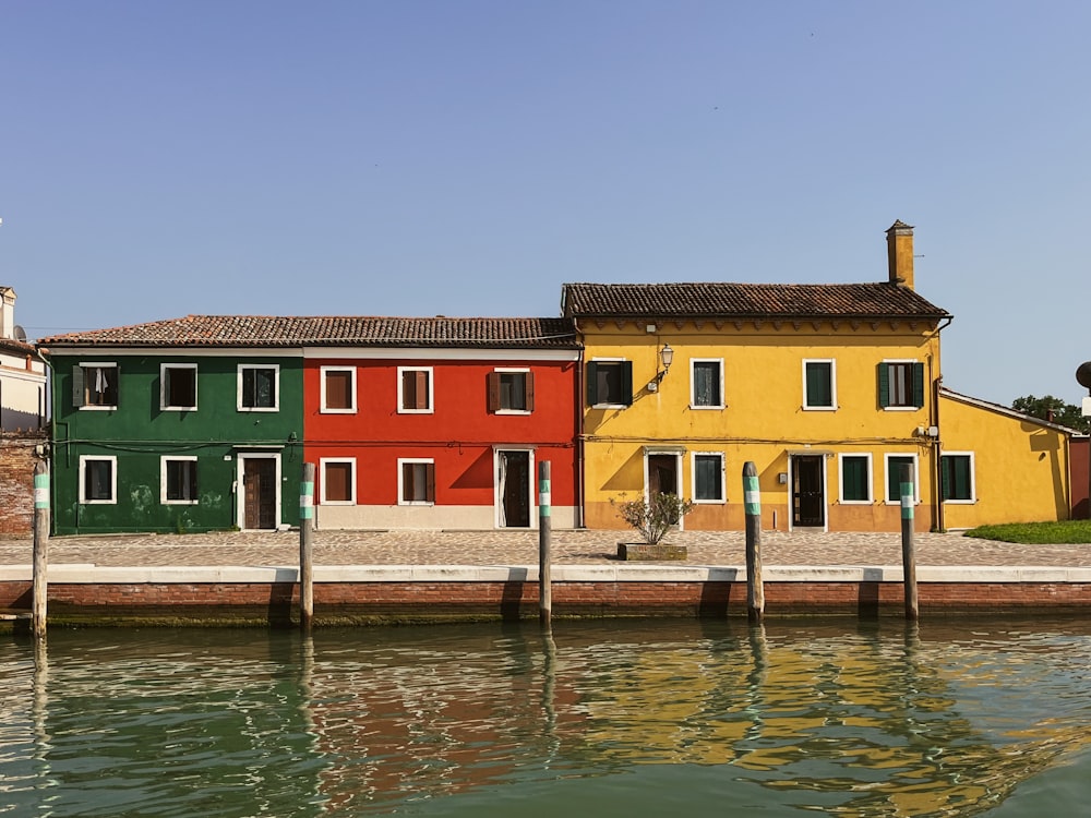 a row of houses next to a body of water